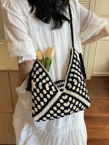 Handcrafted crochet straw tote bag with black fringes and large storage capacity