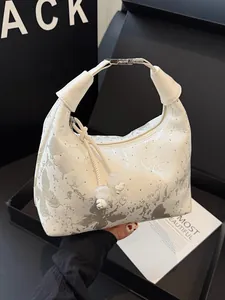 Elegant off-white satin handbag featuring silver butterfly jacquard and rhinestones