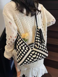Bohemian crochet tote bag with black and white geometric pattern and fringe details