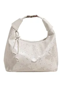 White hobo bag with rhinestone butterfly patterns and bead charms on white background