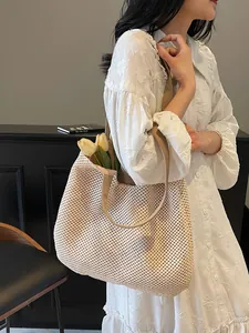Hollow straw woven tote bag for summer beach vacation with wide shoulder strap
