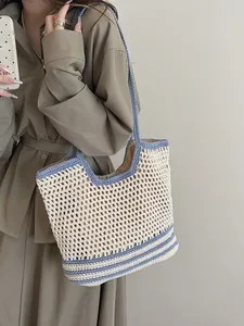 Chic woven crochet tote bag in beige and blue, handmade openwork style for summer beach vacations