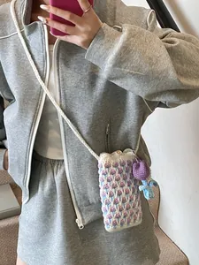 Handmade crochet tulip crossbody phone bag with floral charm and woven strap