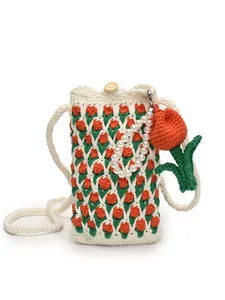 Handmade crochet tulip phone bag with white knit texture and wooden button closure