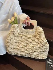 Handwoven straw tote bag with rectangular wooden handles for summer beach vacations