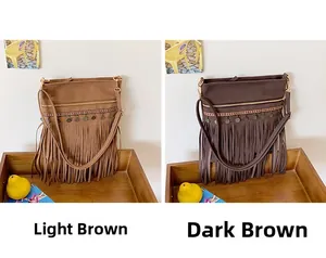 Detail of vintage bohemian crossbody bags in brown and coffee with ethnic fringe trim