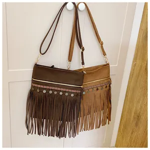 Detail of retro fringe crossbody bags with ethnic embroidery and metallic sequins decoration