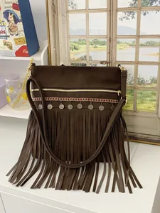 Brown rivet tassel crossbody bag with bohemian strap and ethnic fringe details