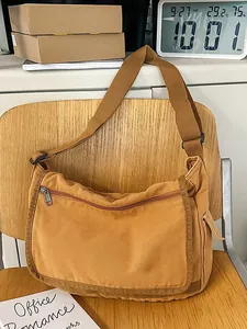 Large capacity khaki canvas messenger bag with adjustable strap for daily commute and school