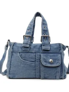 Light blue washed denim crossbody handbag with silver hardware and front pocket