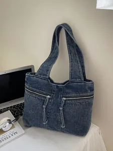 Large blue denim tote bag for women with dual front zippers and spacious shoulder strap