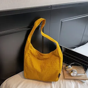 Minimalist mustard yellow canvas tote bag for daily commute shown in a cozy home setting