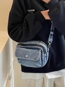 Retro washed denim crossbody bag with adjustable strap and multiple zip compartments