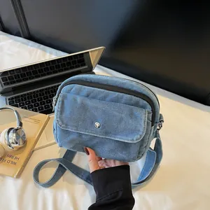 Chic blue denim crossbody square bag with metal buckle and shoulder strap for women