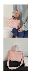 Detailed view of pink nylon mini bucket bag with adjustable fabric shoulder strap