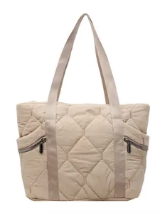 Quilted beige nylon tote bag with lattice pattern and wide shoulder straps