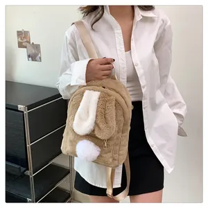 Detail of soft lamb-like plush rabbit ears and fluffy tail on the two-tone backpack