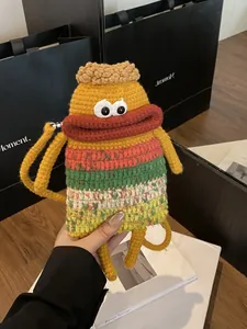 Sac bandoulière tricoté main avec design de monstre cartoon aux grandes lèvres rouges