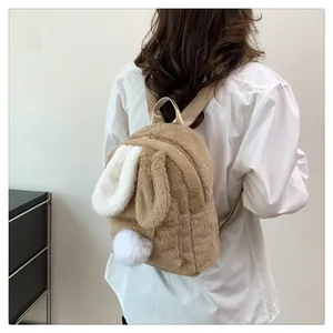 Detailed view of the soft faux fur texture and cute rabbit ear design on the khaki backpack