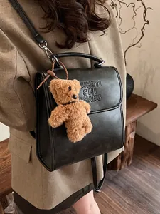 Vintage black PU leather backpack with letter embossing and cute bear charm for women