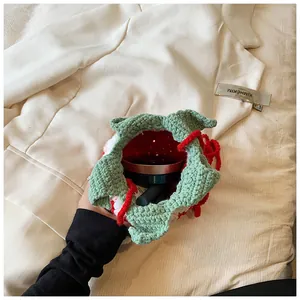 Detail showing the internal storage capacity of the handmade strawberry crochet bag