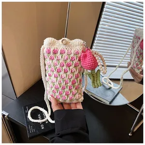 Detailed handmade tulip crochet mini bag with pearl handle and wooden button