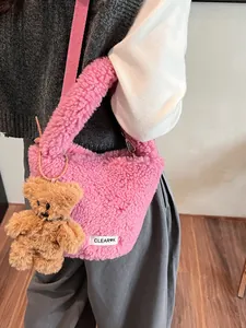 Pink plush lamb wool bucket bag with cute bear charm and woven strap for women