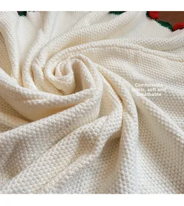 Vue détaillée du tissu en maille blanche douce avec une texture nid d'abeille fine