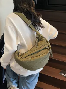 Olive green nylon half-moon crossbody bag with adjustable strap in casual style