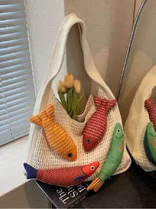 White knit tote bag with colorful 3D fish charms for beach and casual commute