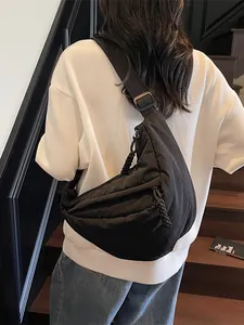 Versatile black crescent hobo bag for women with adjustable strap and pleated nylon detail