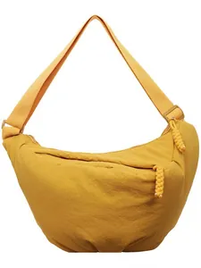 Versatile ginger yellow nylon crescent bag with adjustable wide strap and knotted zipper