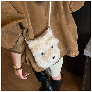 Detail of cute white plush dog crossbody bag with soft faux fur texture and silver hooks