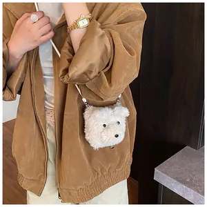 Close-up of white plush puppy crossbody bag with fluffy faux fur texture and leather strap