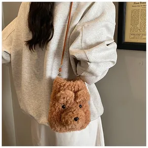 Close-up of brown plush bear crossbody bag worn by model showing soft teddy fur texture