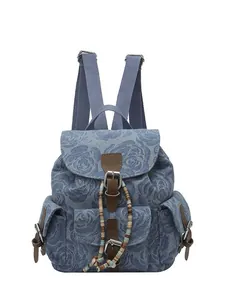 Retro denim backpack with rose patterns, brown leather straps, and colorful beaded accents