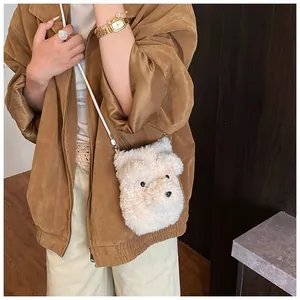 Mini plush bear crossbody bag in white faux fur worn by a model in casual autumn outfit
