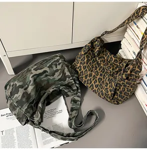 Detailed texture of leopard and camouflage canvas messenger bags for college students