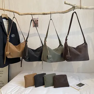 Detail view of stylish tote bag set in four earthy colors with matching mini pouches
