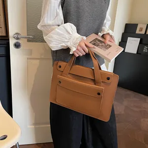 Close-up of deep brown business briefcase for women with a front flap pocket for commute