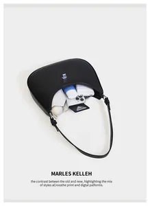Interior view of black leather hobo bag showing capacity with phone and umbrella