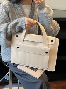 Chic beige leather business briefcase for women featuring a minimalist handheld design