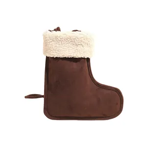 Brown suede winter boot bag with white faux fur trim and hanging hook detail