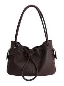 Dark brown pebble leather tote bag with drawstring closure and star-shaped charm