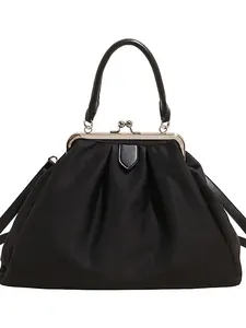 Black cloud handbag with vintage metal frame clasp and pleated fabric detail for women