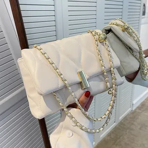 Chic quilted beige chain shoulder bag with gold hardware and flap closure for women