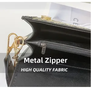 Macro detail of high-quality Jacquard fabric with gold hardware zipper and clasp