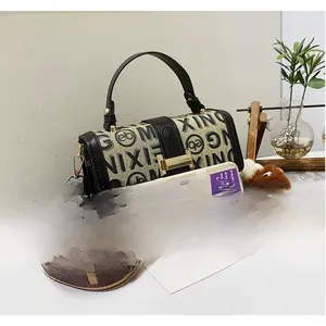 Compact canvas crossbody bag with letter print and floral pattern wide strap detail