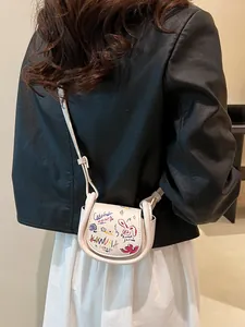 Mini sac besace crème avec graffitis colorés et fine bandoulière pour femme chic