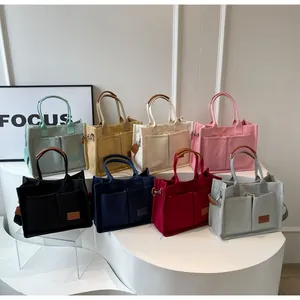 Borse tote in tela multitasche in otto colori inclusi verde menta e blu marino